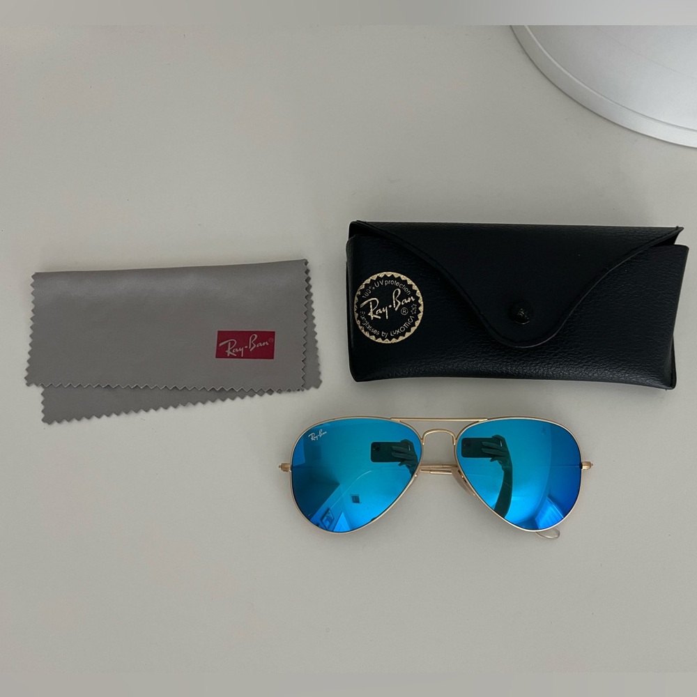 Ray Bans Aviators. Blue lenses gold frames. Case and cleaning cloth included.